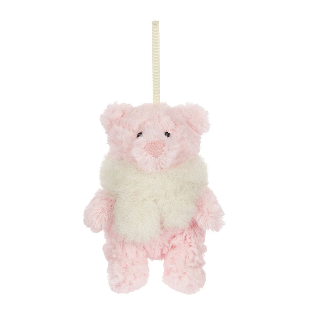 A small plush teddy bear ornament or hanging decoration in soft pink and cream white, with a cream hanging loop at the top, shown against a plain white background.
