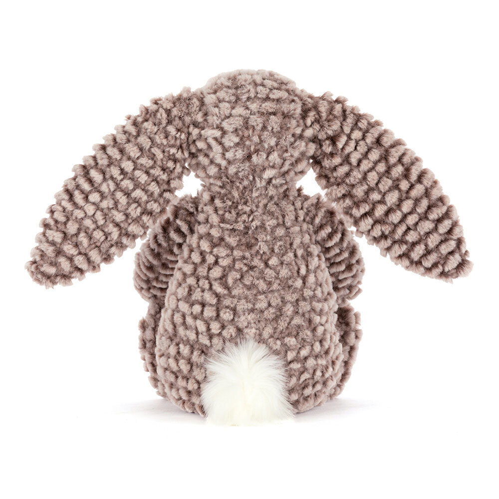 Plush bunny toy with a soft texture on a white background
