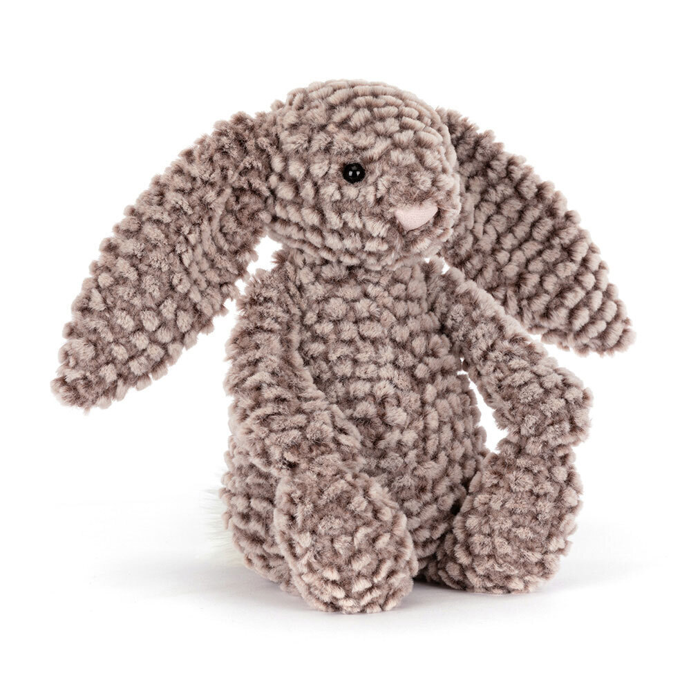 Plush bunny toy with textured fur on a white background