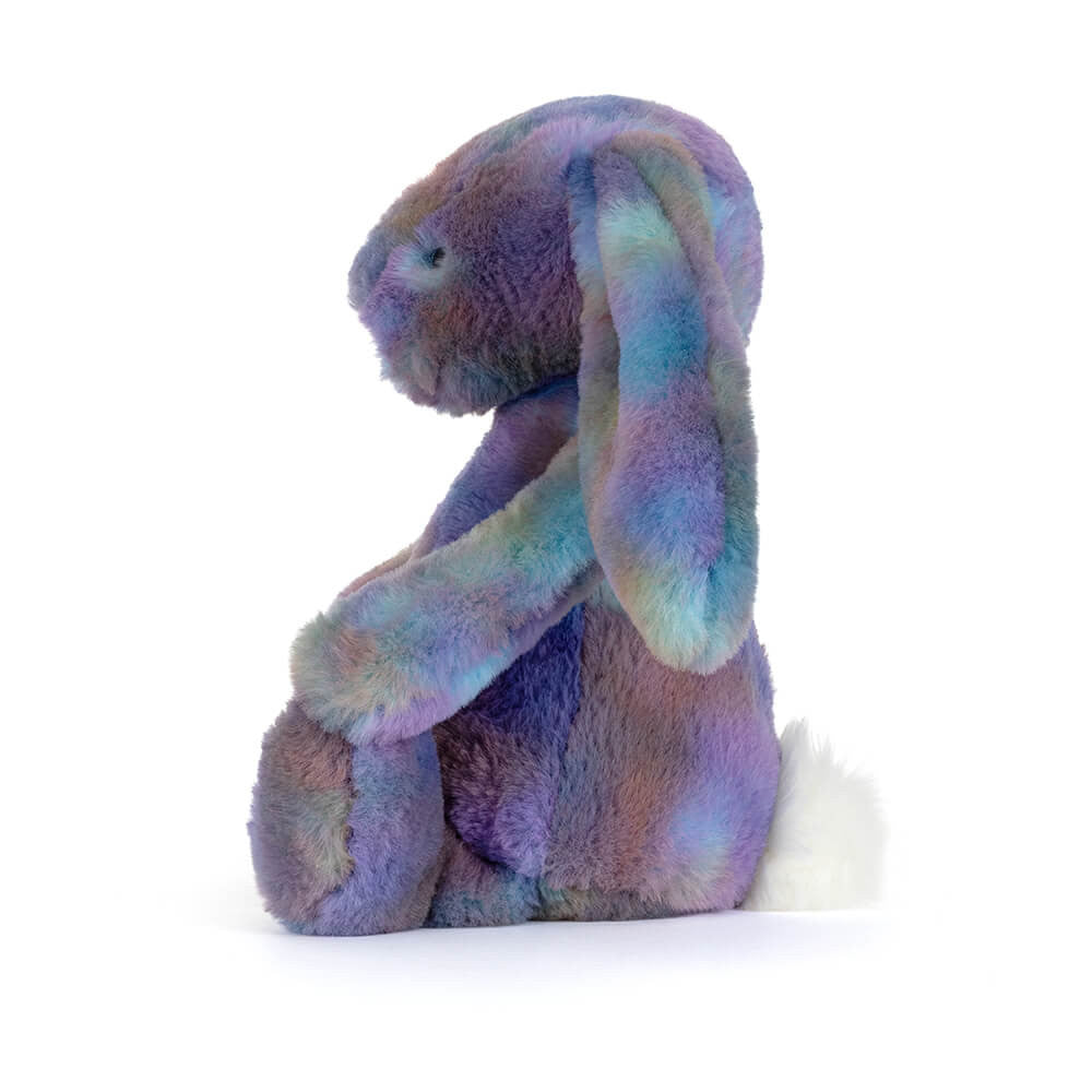 Multicolored plush bunny toy on a white background