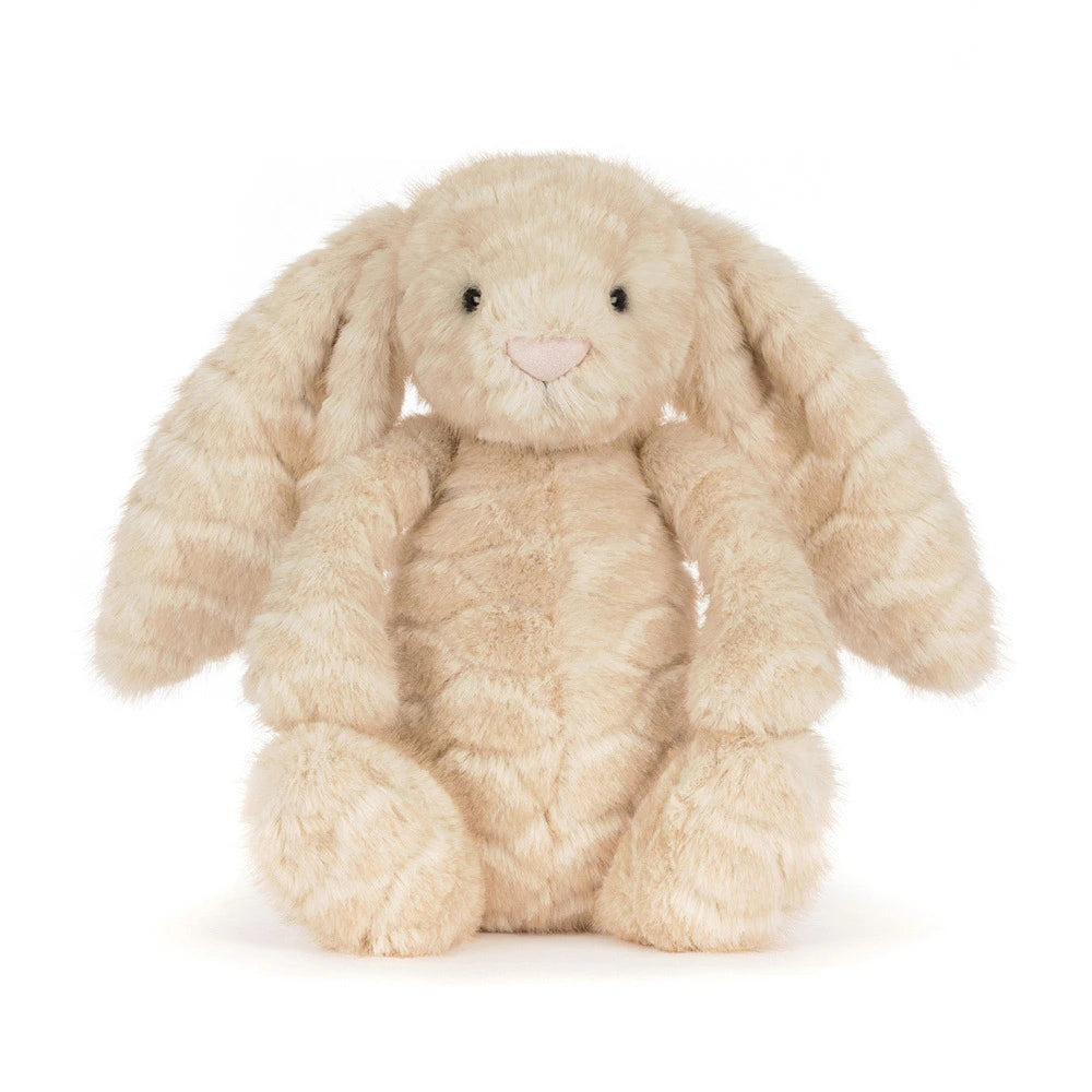 A plush stuffed bunny toy in a light cream-beige color with long floppy ears, black bead eyes, and a small pink stitched nose, photographed on a clean white background.