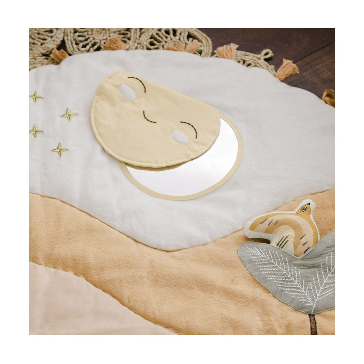 Baby bib and blanket set with fox design on a wooden surface