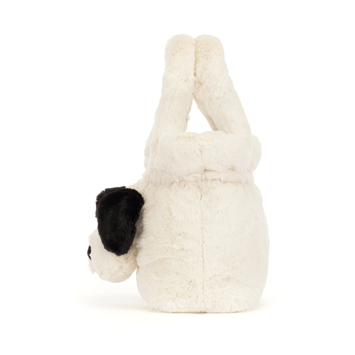 A plush dog-shaped handbag in off-white faux fur with black ears and a black nose, photographed on a clean white background.