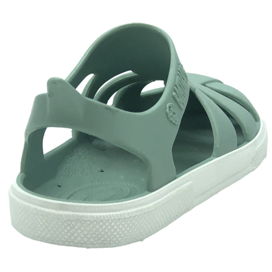 Green sandal with a white sole on a white background