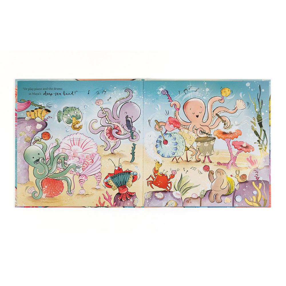 Illustrated book open to pages with colorful sea creature illustrations on a white background
