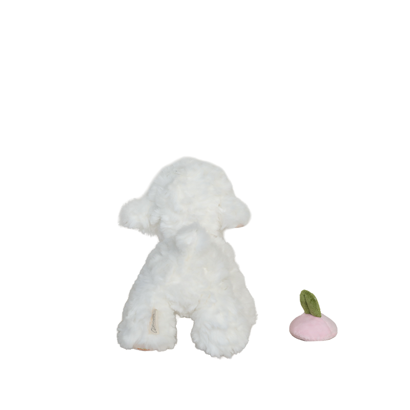 White plush dog toy with a pink and green object on a white background