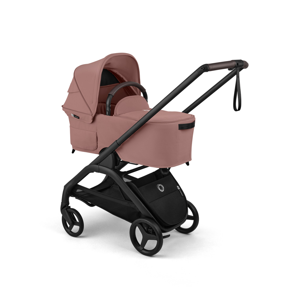 A baby stroller travel system in dusty rose pink and black, shown from a three-quarter angle on a solid white background. The stroller features a pink bassinet, a black frame, and a matching black handlebar.