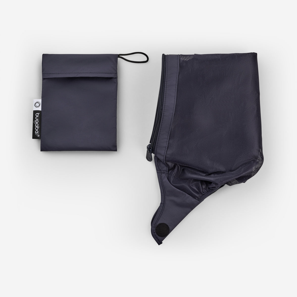 Black rain poncho and pouch on a white background