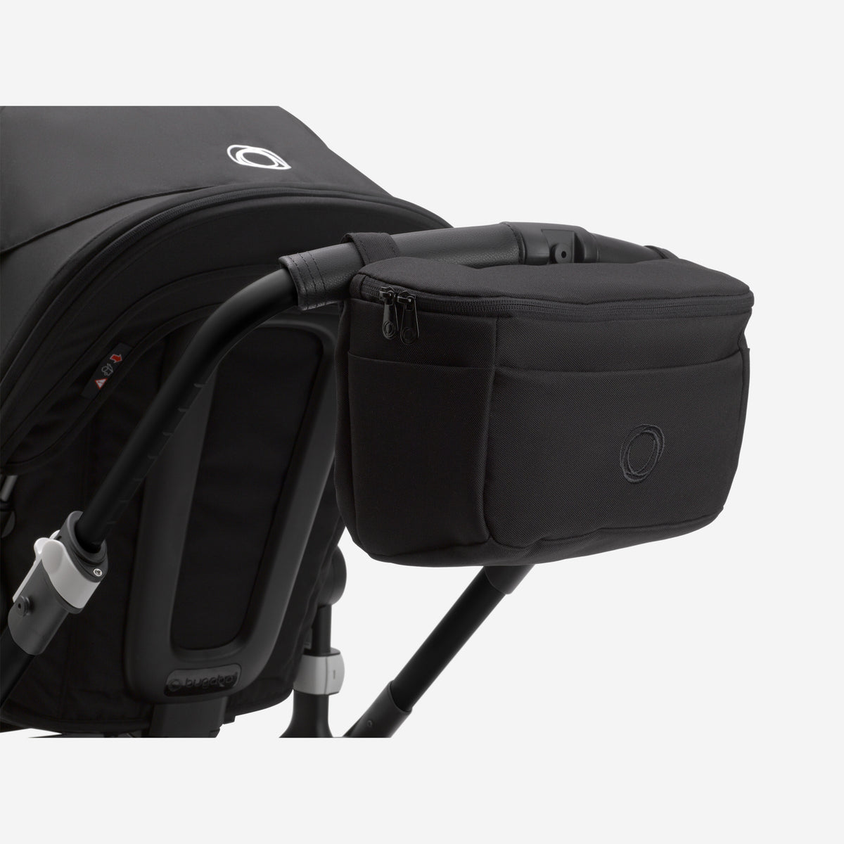 Black stroller with a storage bag attached on a white background