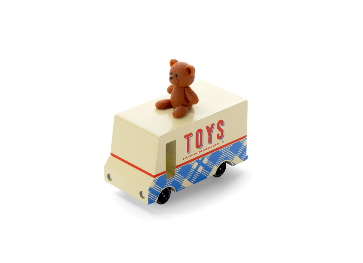 Toy truck with a teddy bear on top, labeled 'TOYS', on a white background