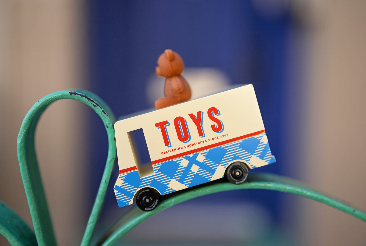 Small toy truck with 'TOYS' on a blurred background
