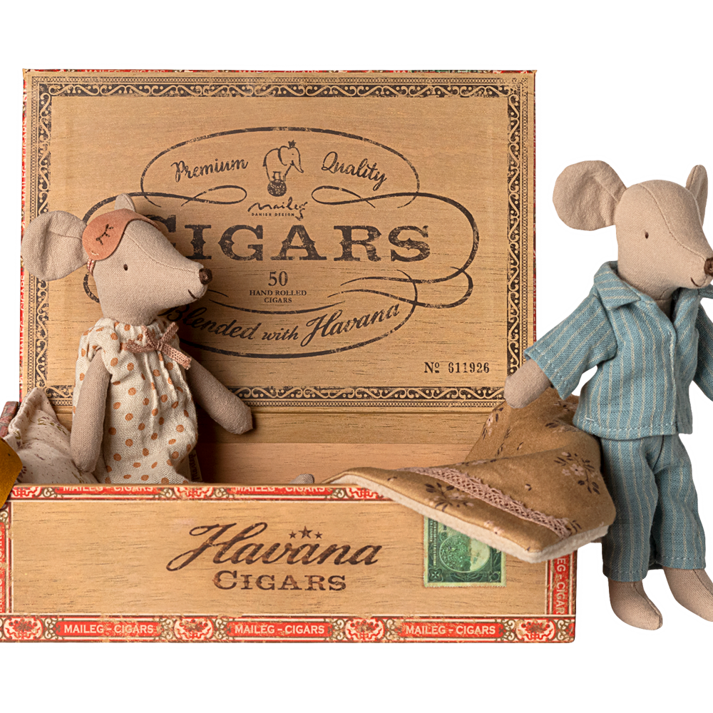 Maileg Mum mouse resting inside a vintage cigar box while Dad mouse stands outside next to it.