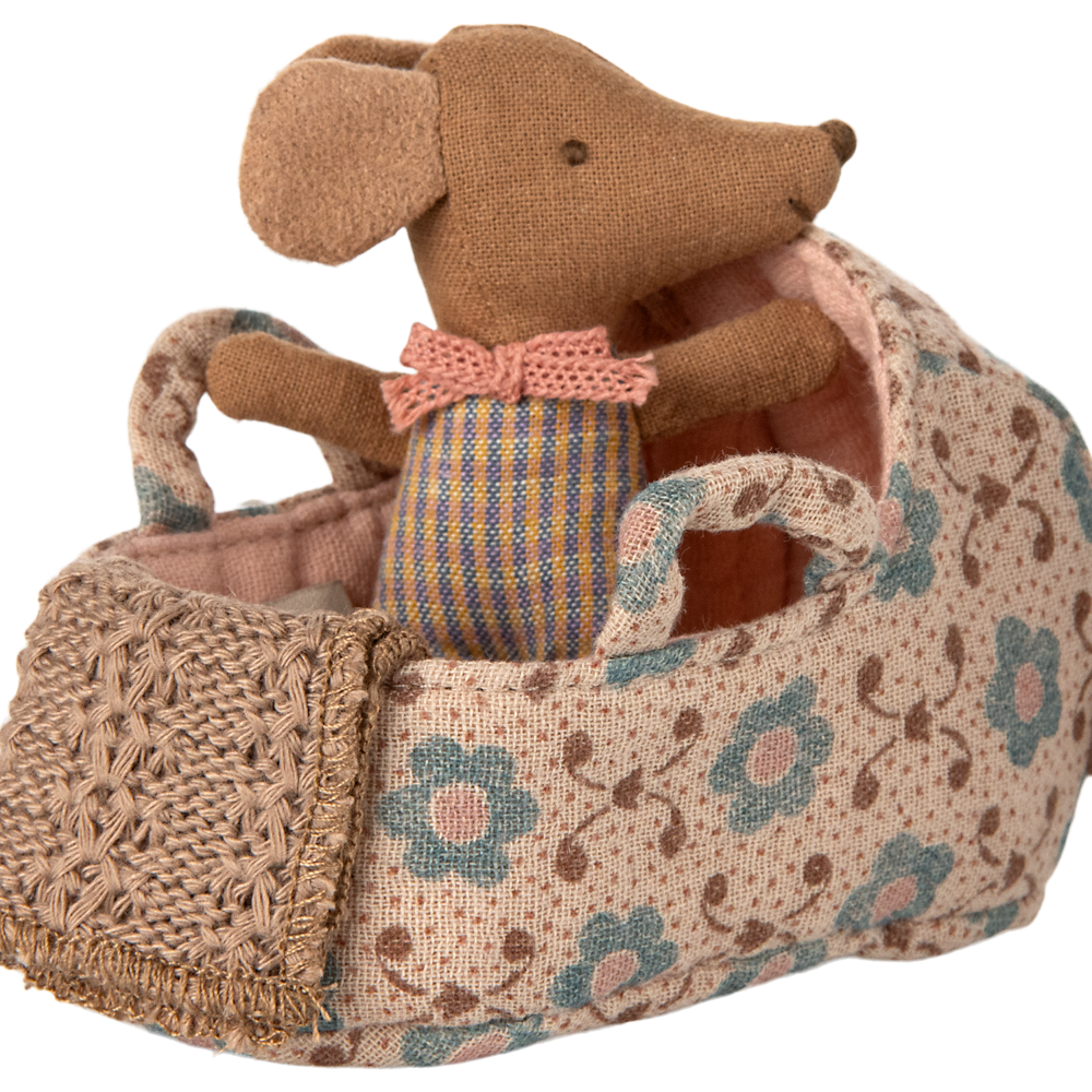 Stuffed mouse toy with a floral-patterned basket on a white background