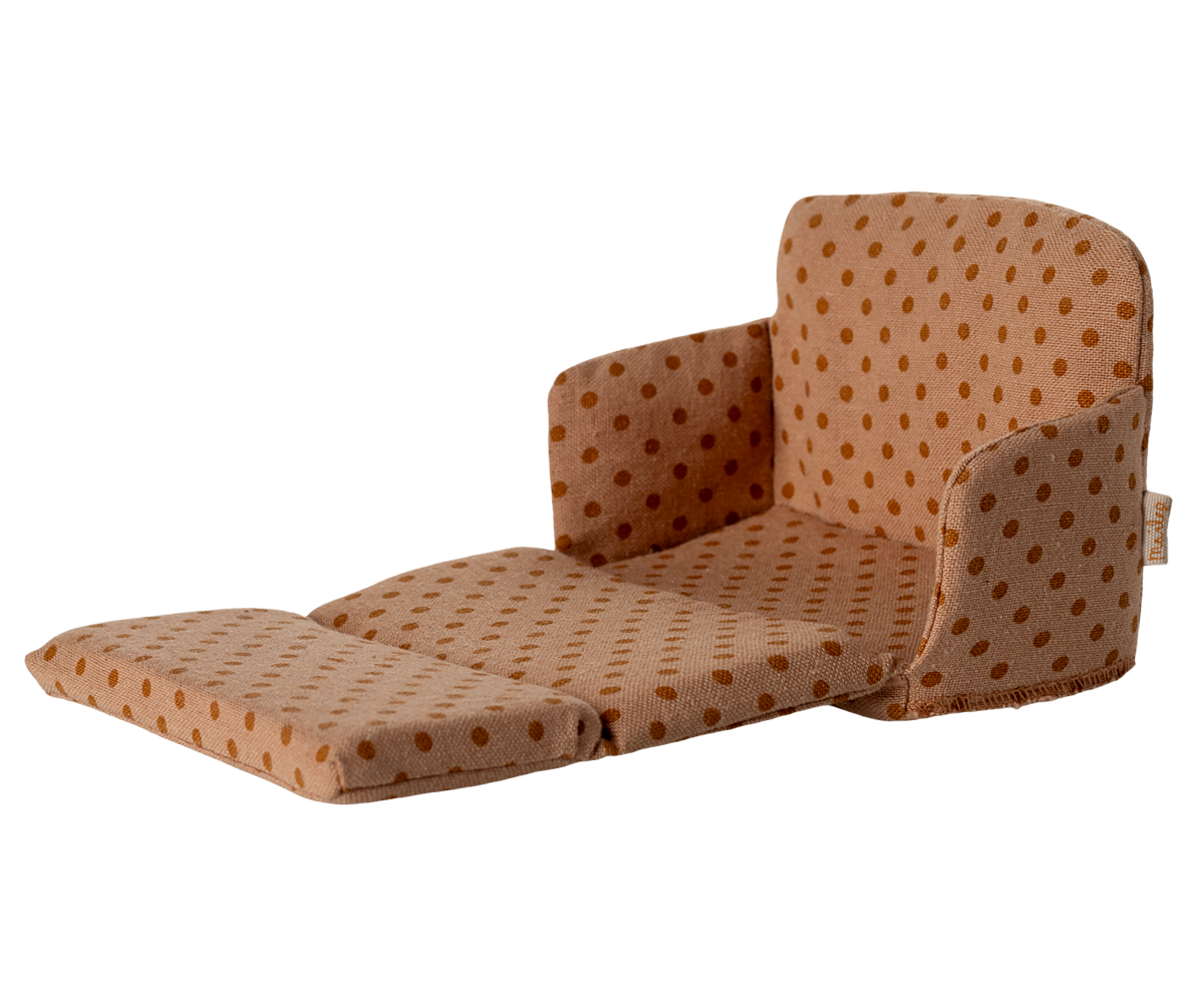 Brown polka dot chair on a white background