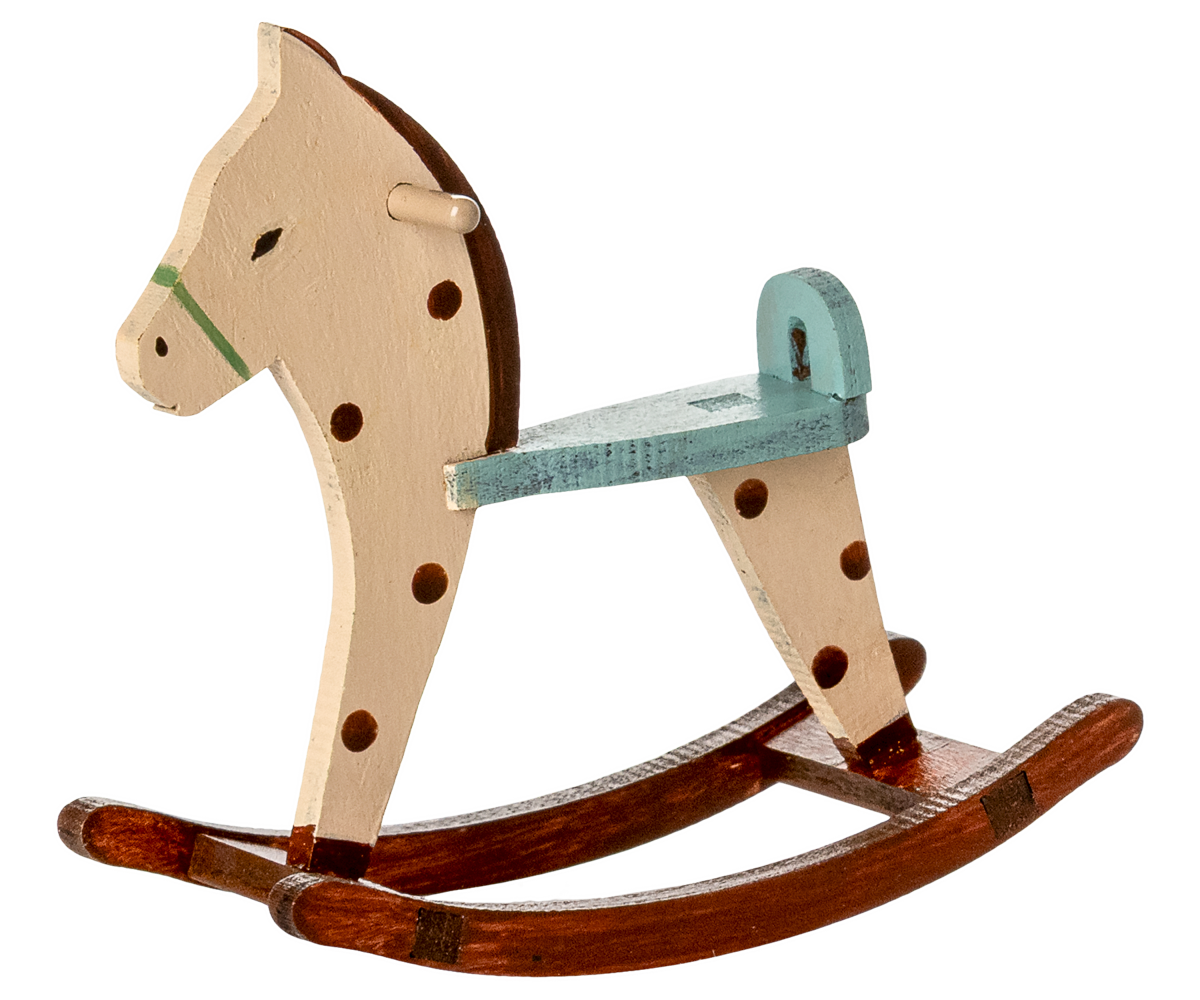 Wooden rocking horse with a white background