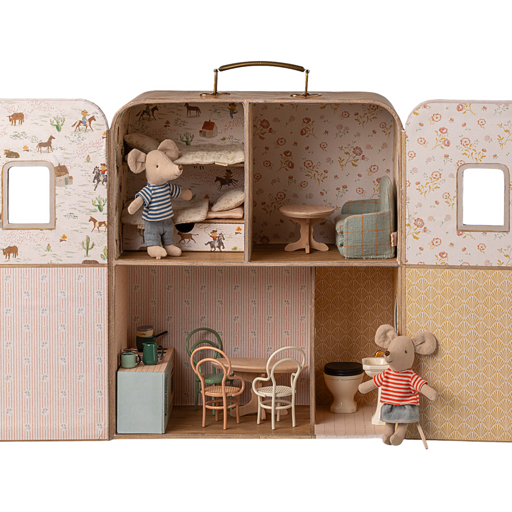 Miniature dollhouse with furniture and toy mice inside a suitcase