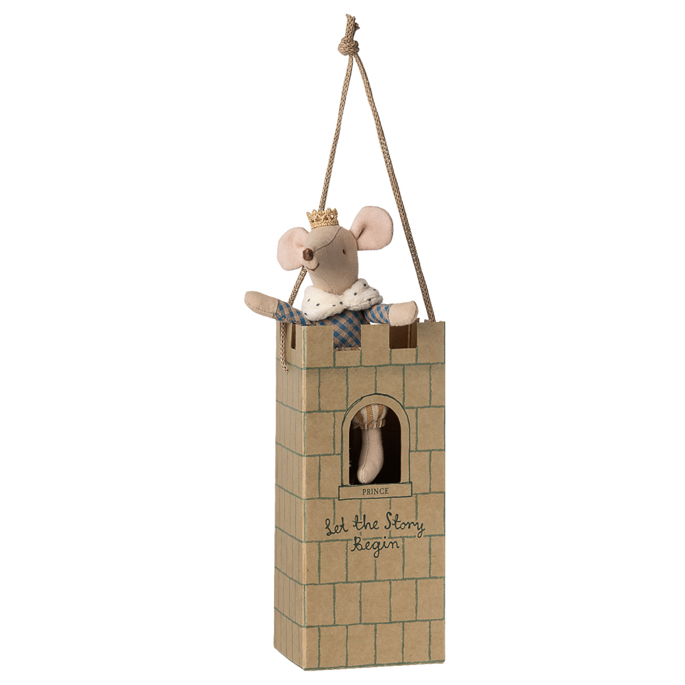 Stuffed mouse in a small castle toy on a white background