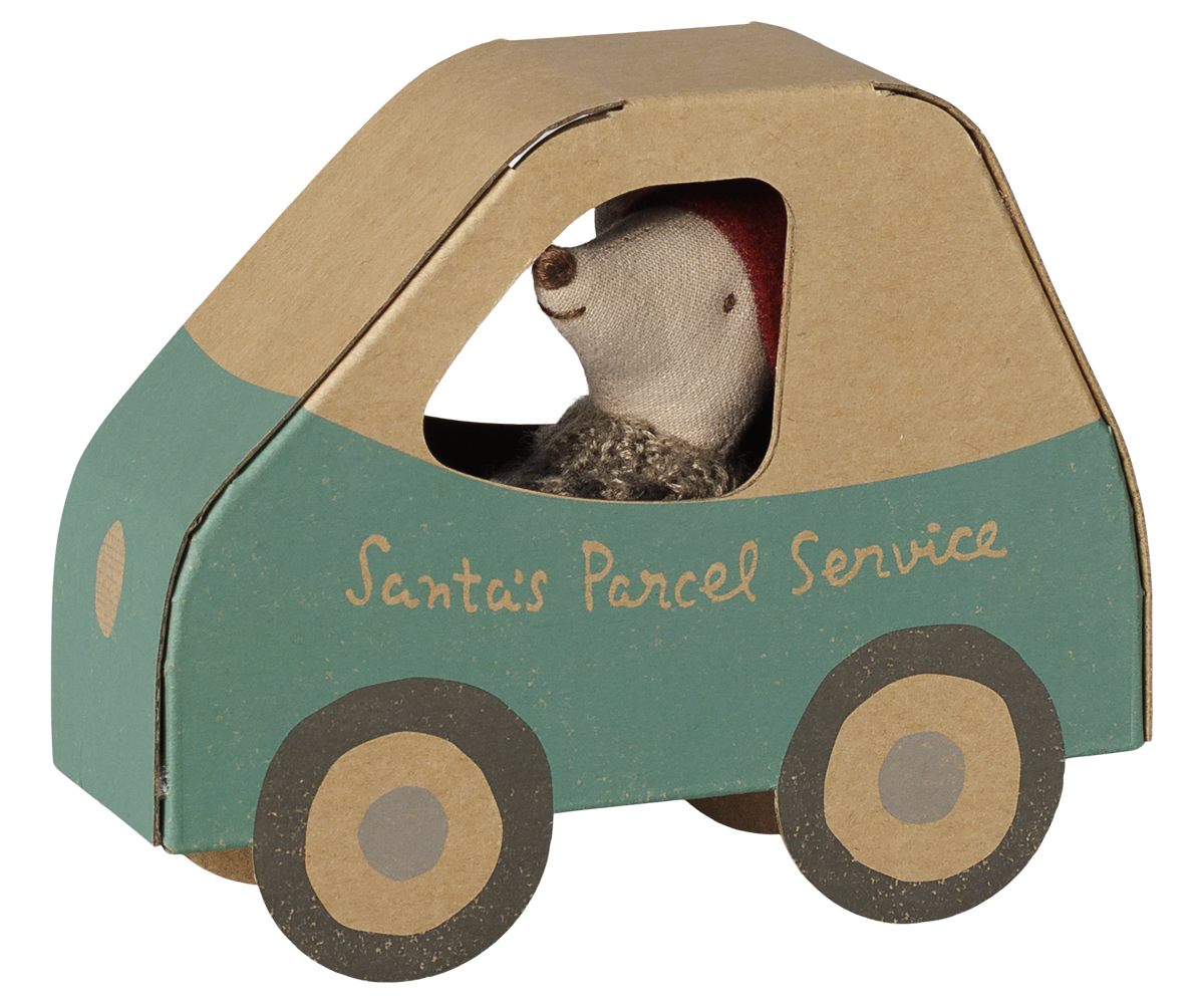 A Maileg Christmas Little Brother mouse peeking out from the window of a teal and cardboard-colored miniature car box labeled "Santa's Parcel Service" on the side.