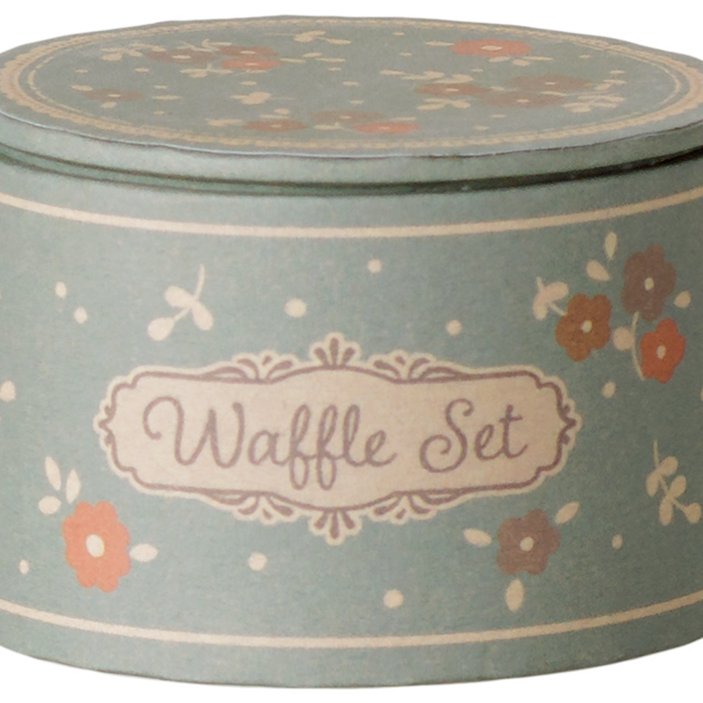 A round, vintage-style blue tin storage box for the Maileg Waffle Set, featuring a floral pattern, polka dots, and a decorative label that reads "Waffle Set."