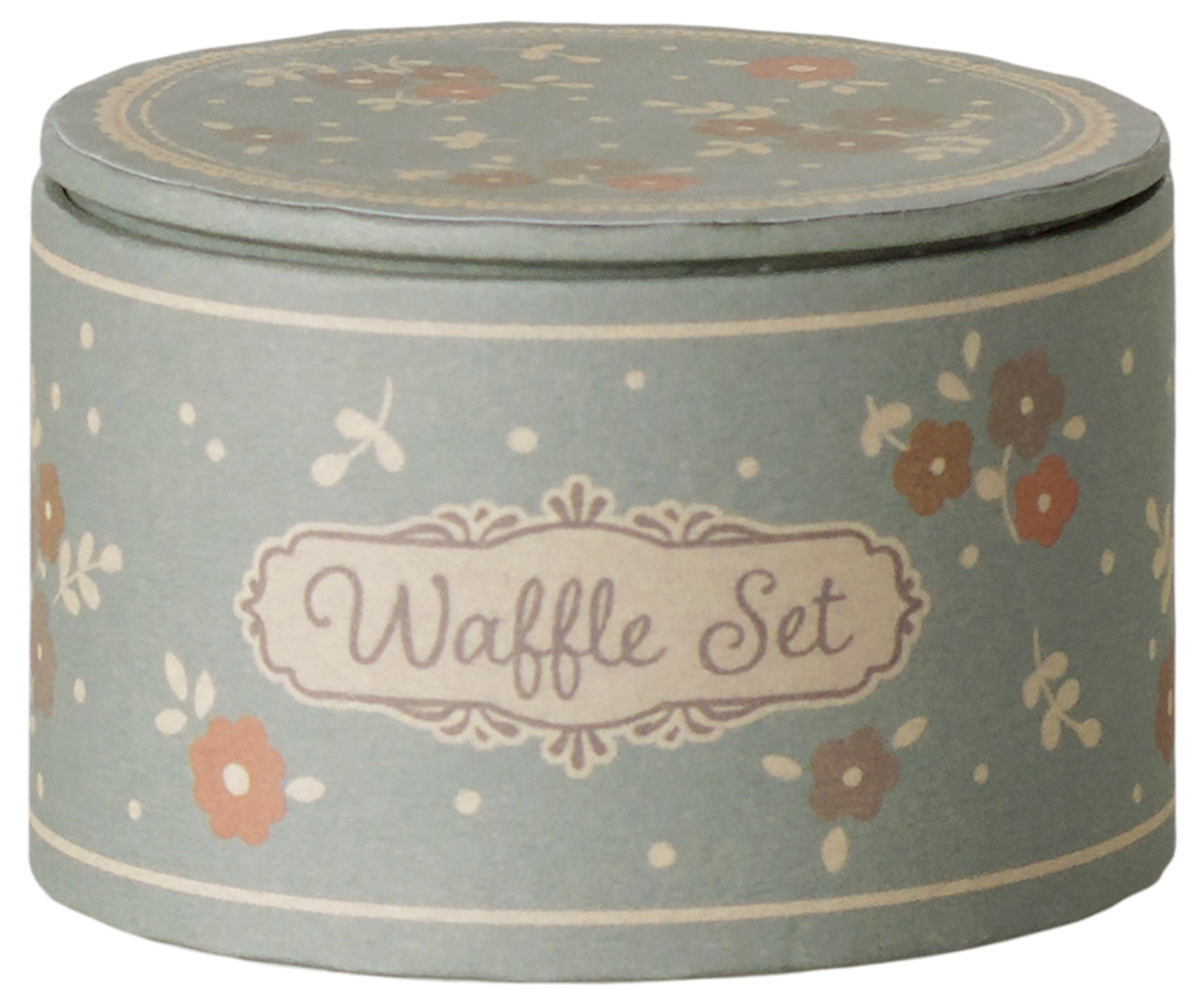 A round, vintage-style blue tin storage box for the Maileg Waffle Set, featuring a floral pattern, polka dots, and a decorative label that reads "Waffle Set."