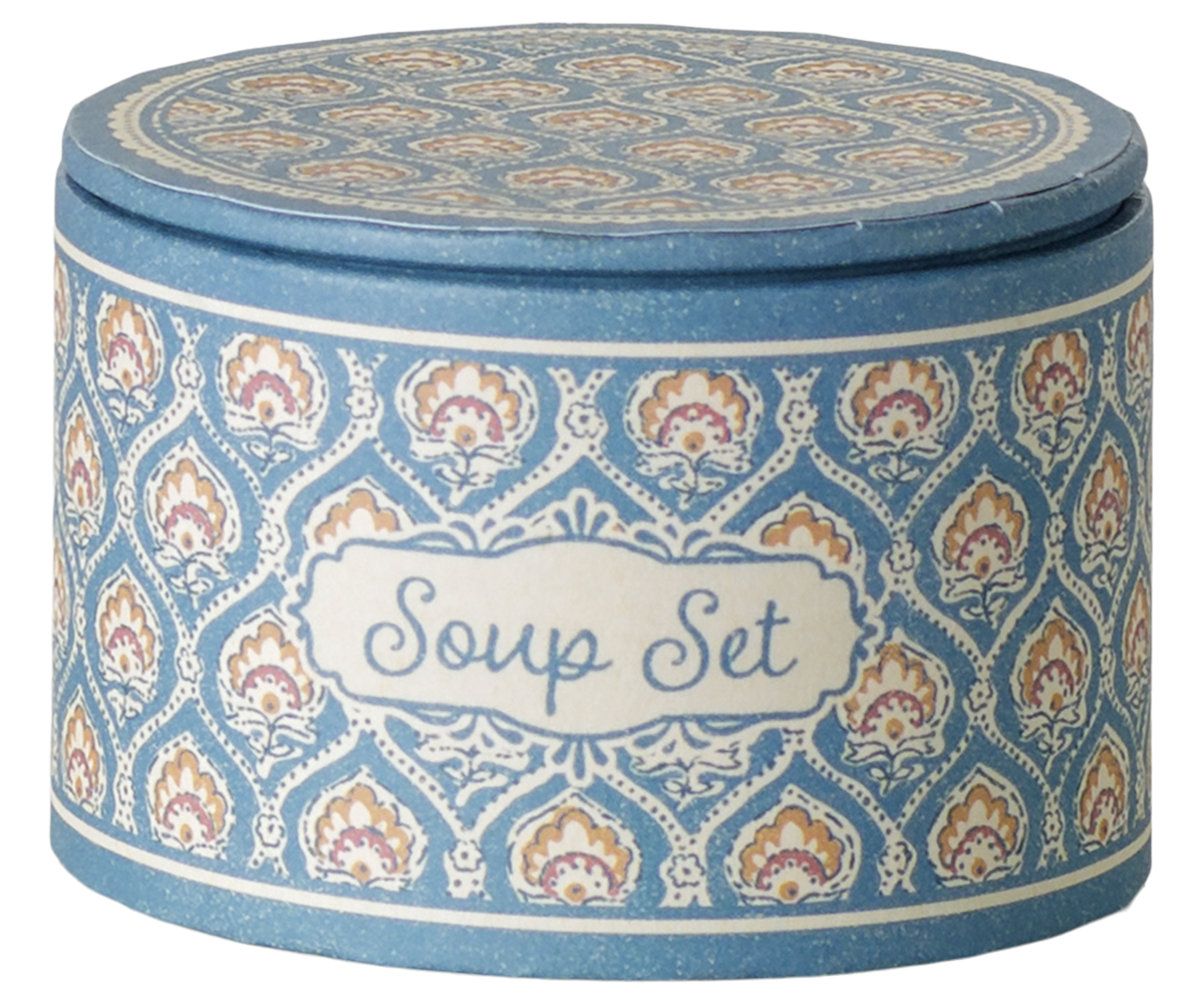 A product photo of the Soup Set, Mouse by Maileg packaging box, featuring a round, blue patterned container with a decorative label on the front that reads "Soup Set" in script lettering.