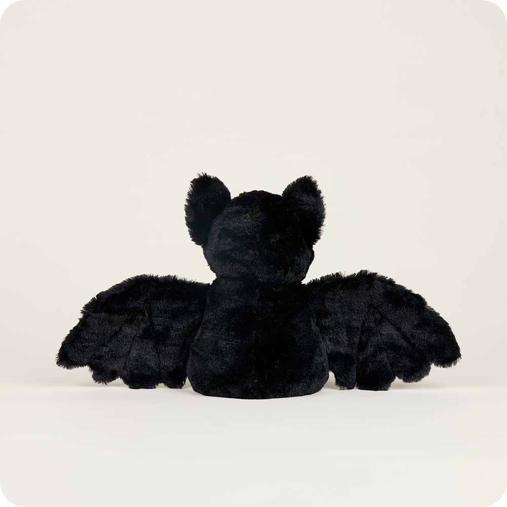 Black plush bat toy on a white background