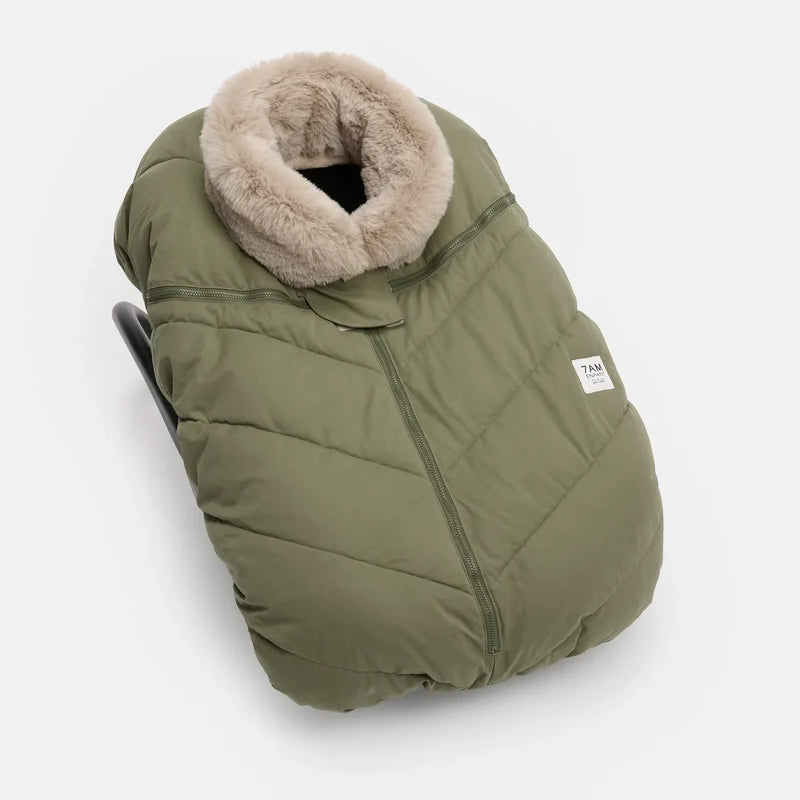 Woodland greige Helsinki Car Seat Cocoon by 7AM Enfant shown from a front angle, featuring a plush faux-fur collar and a quilted puffer texture.