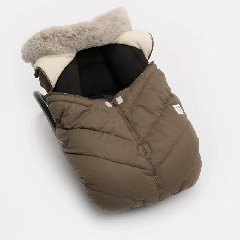 Moss brown Helsinki Car Seat Cocoon by 7AM Enfant showing the front view with a plush faux-fur collar and central zipper.