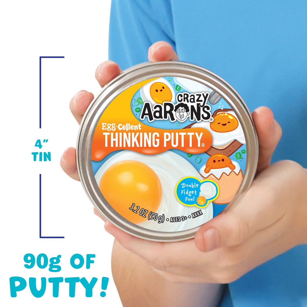 Crazy Aaron's Thinking Putty container held by a person with a blue background
