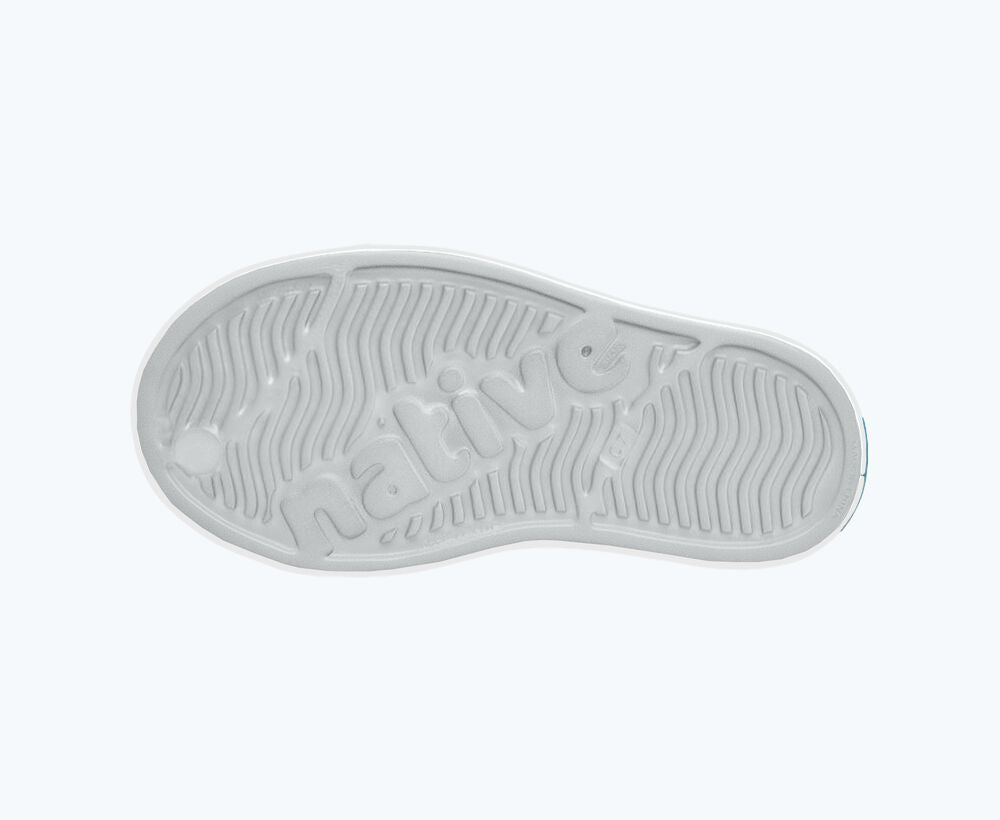 White shoe sole with brand logo on a white background
