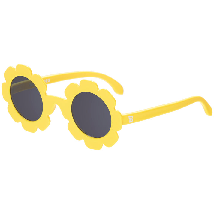 Yellow sunglasses with floral design on a white background