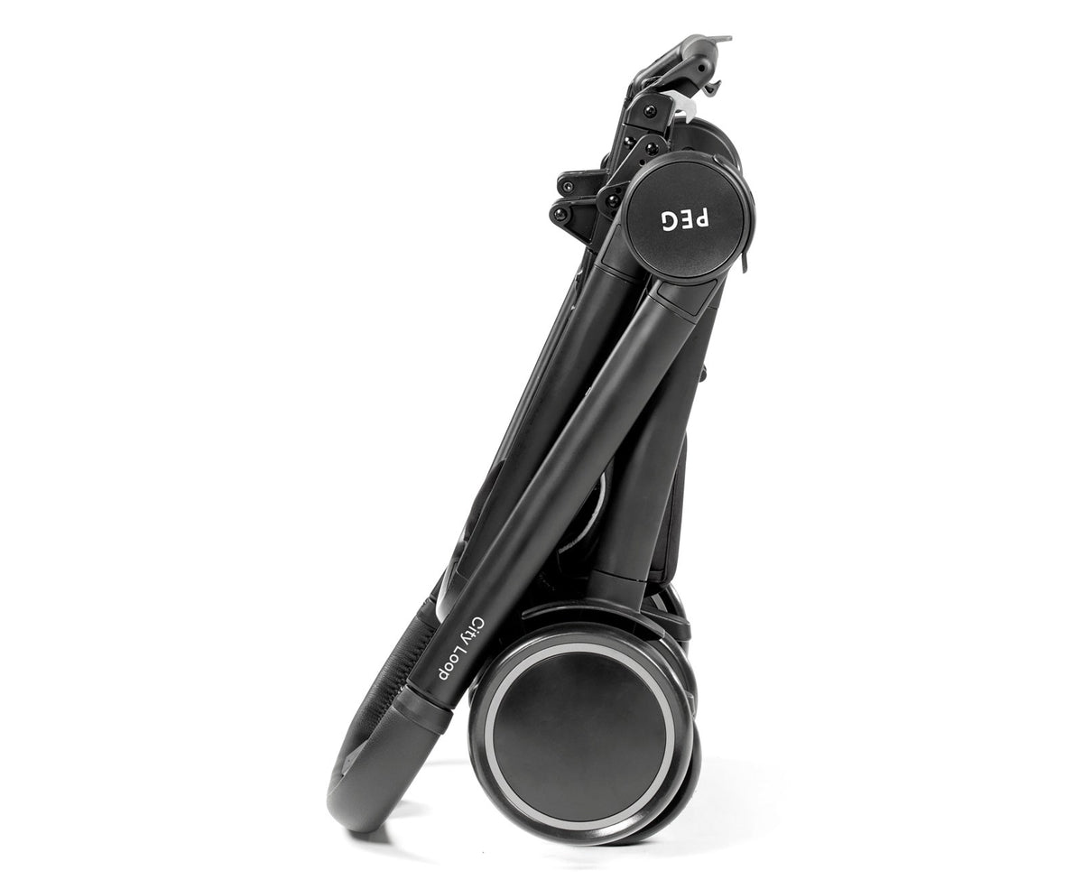 A dark gray baby stroller folded on a white background.