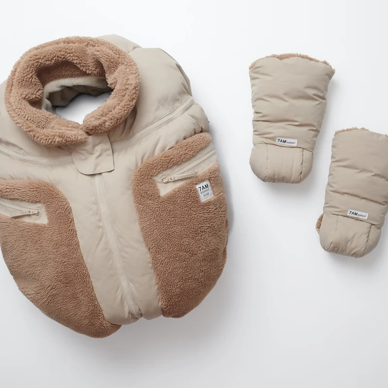 Benji Applique Car Seat Cocoon by 7AM Enfant in oat with brown sherpa, displayed alongside matching mittens and hat against a white background.