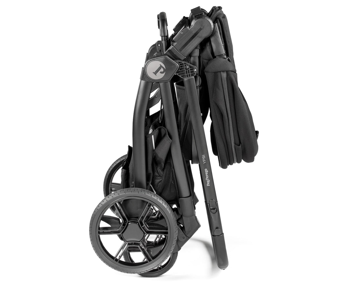 Folded black stroller on a white background