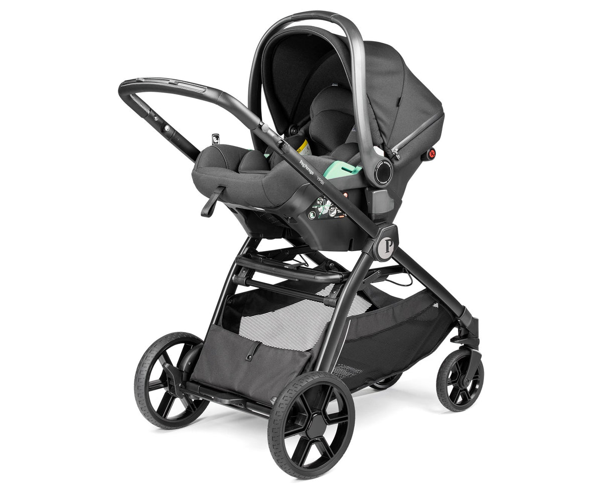 Black stroller with car seat attachment on a white background
