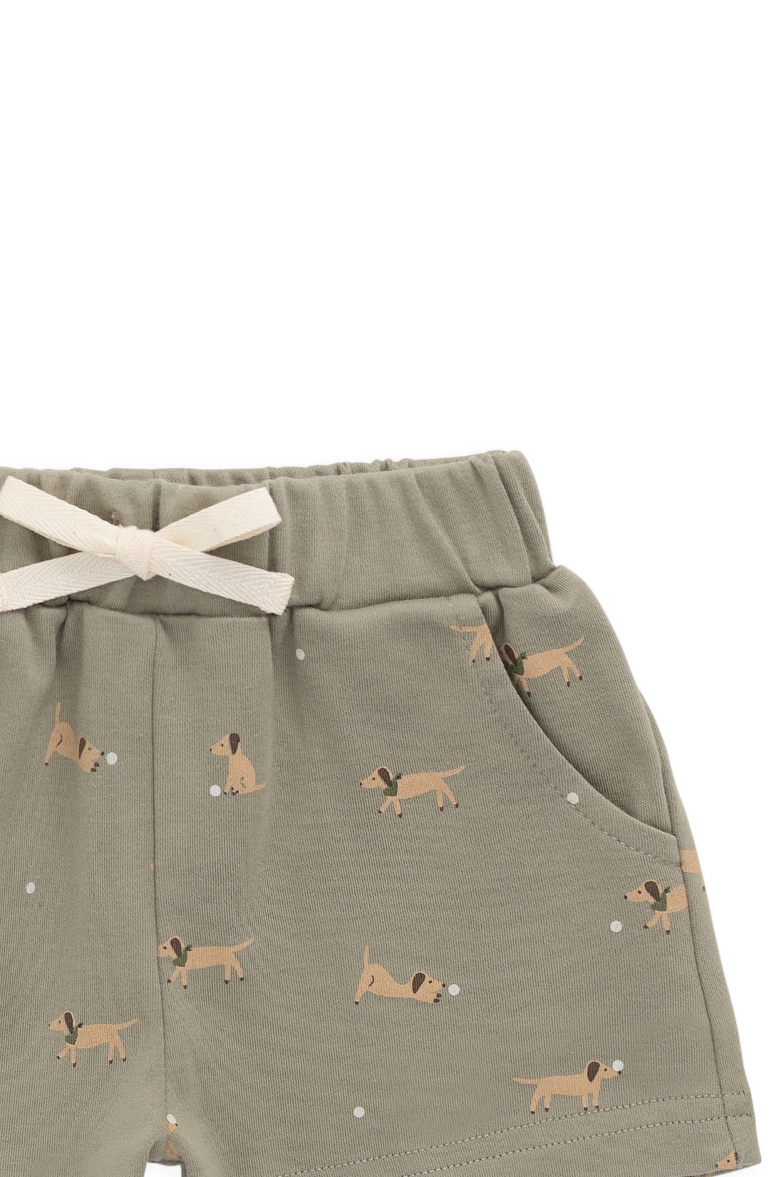 Green shorts with dog pattern and white drawstring on a white background