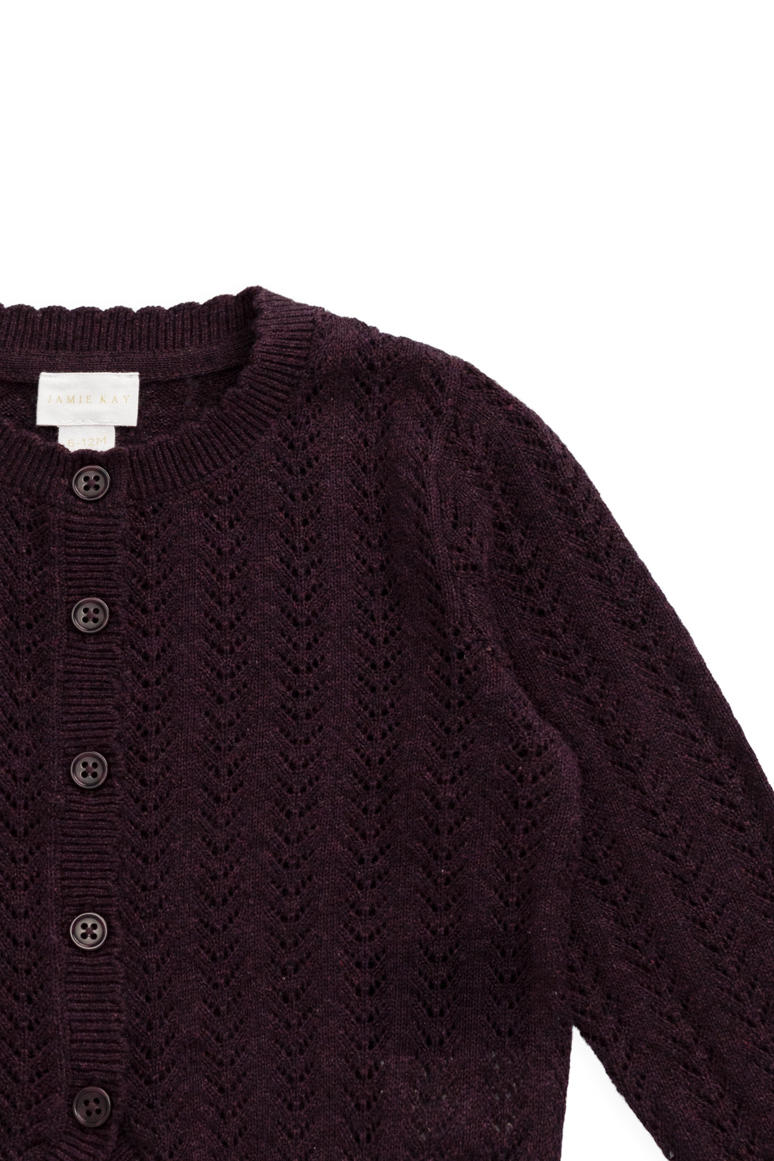 Dark purple knitted cardigan with buttons on a white background