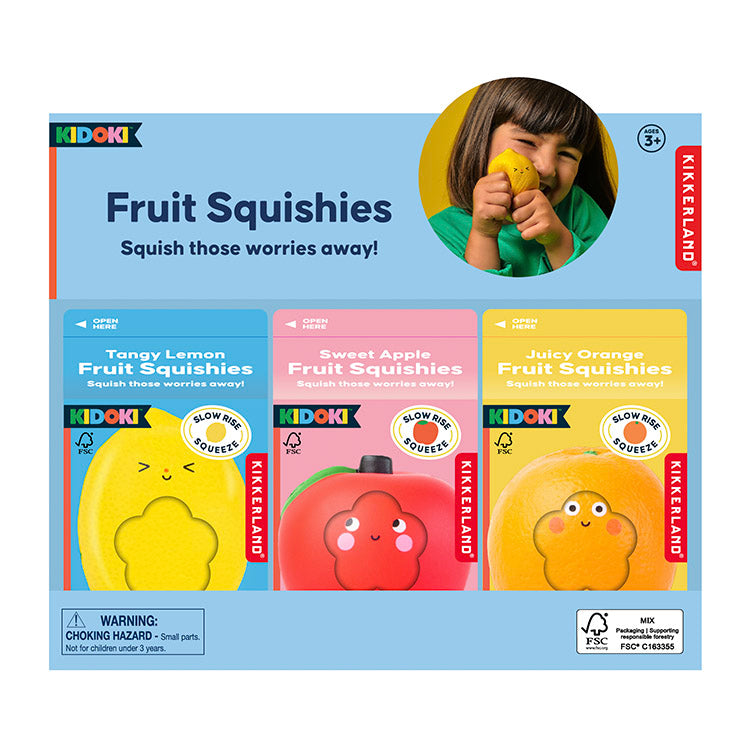 Kiddoki Fruit Squishies packaging with a child holding a yellow squishy toy.