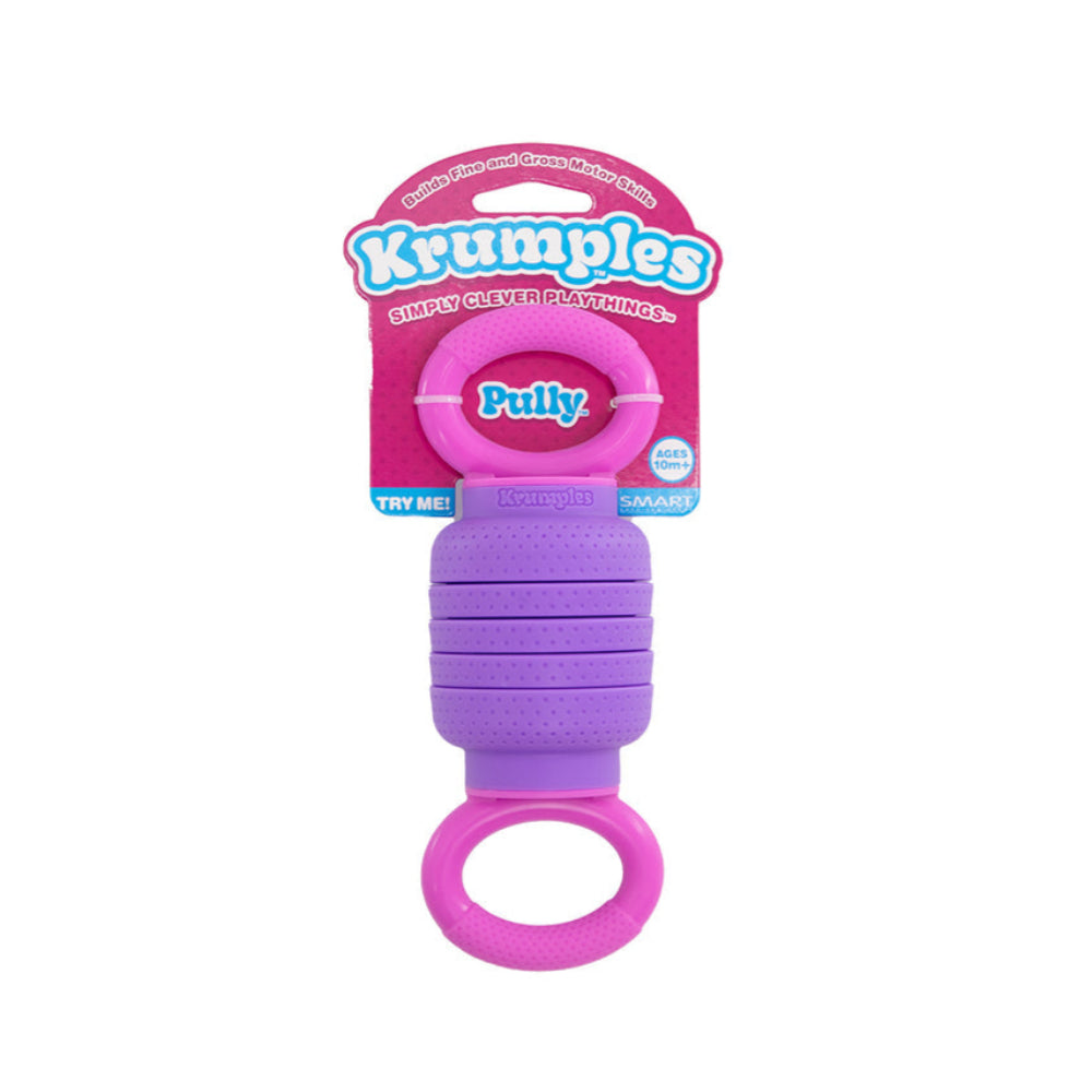 A purple and pink textured dog toy with a ring handle, attached to a pink cardboard backing card branded 'Kruples' and 'Pully'.