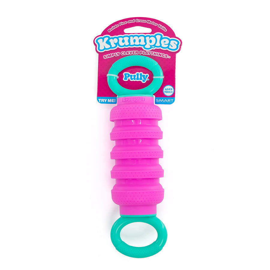 Pink and green Krumples toy with packaging on a white background