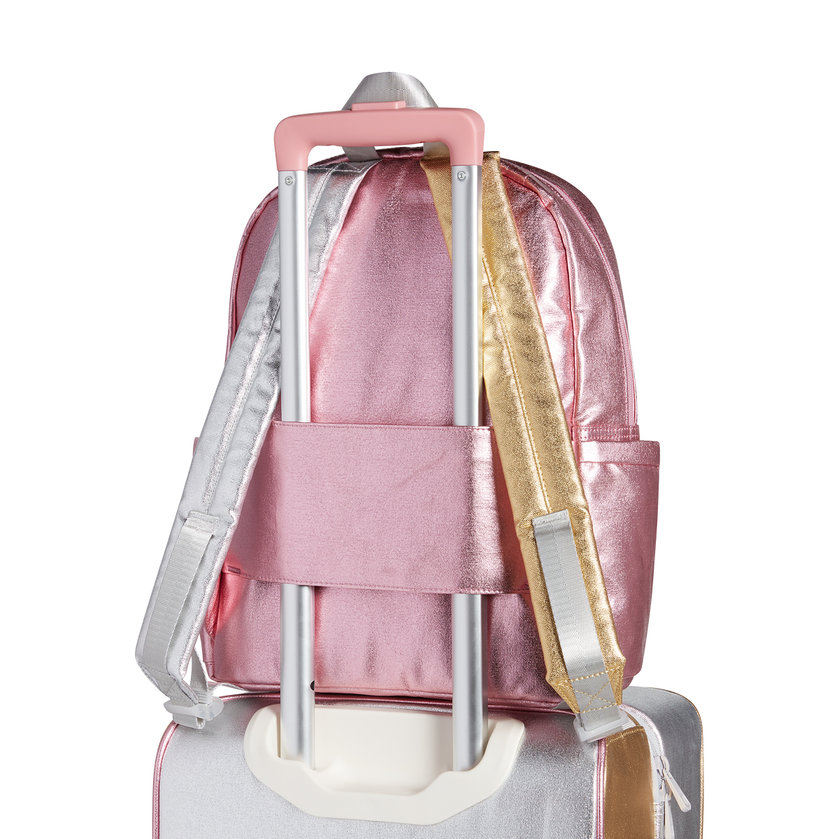 Pink backpack with a rolling suitcase attachment on a white background