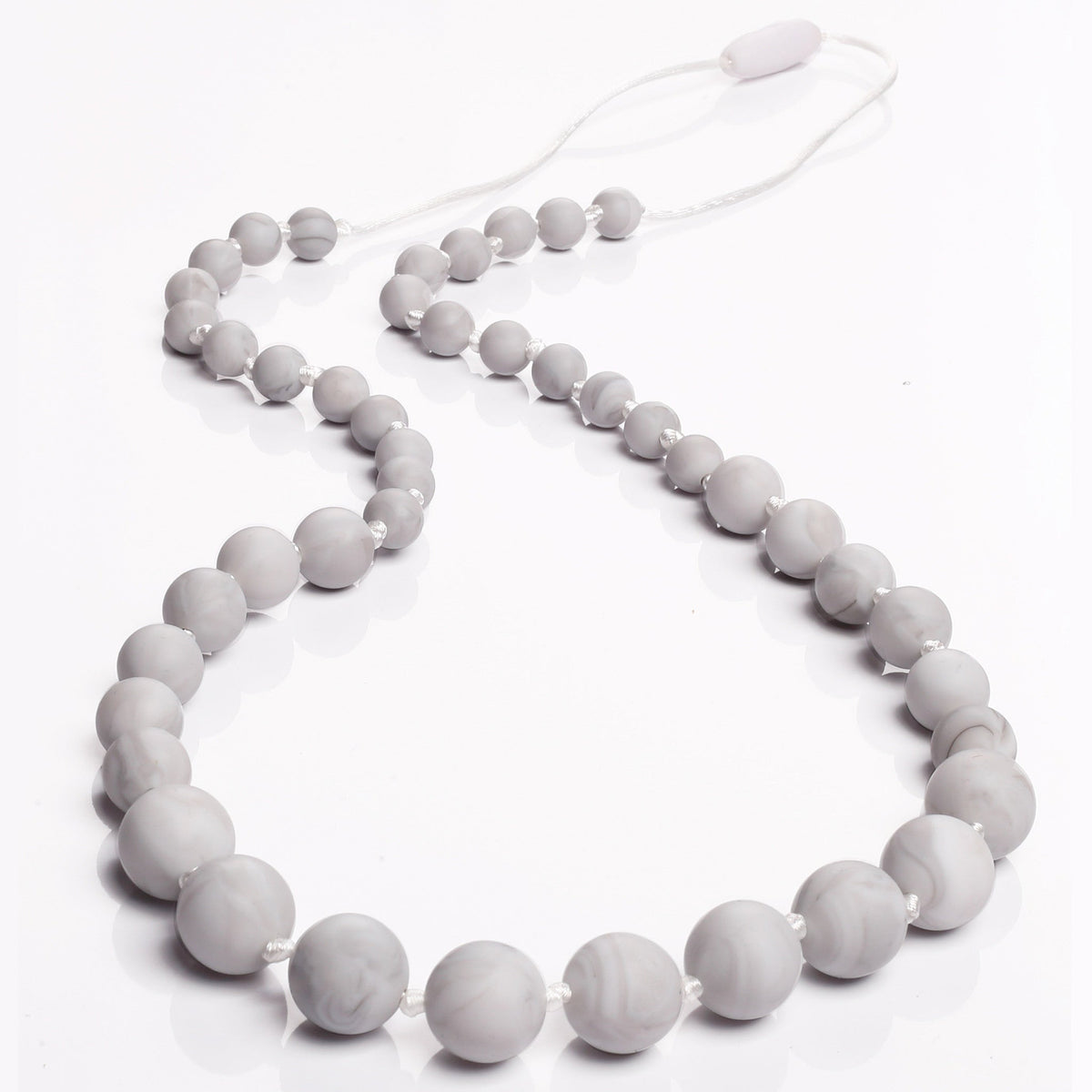 Necklace with gray beads on a white background