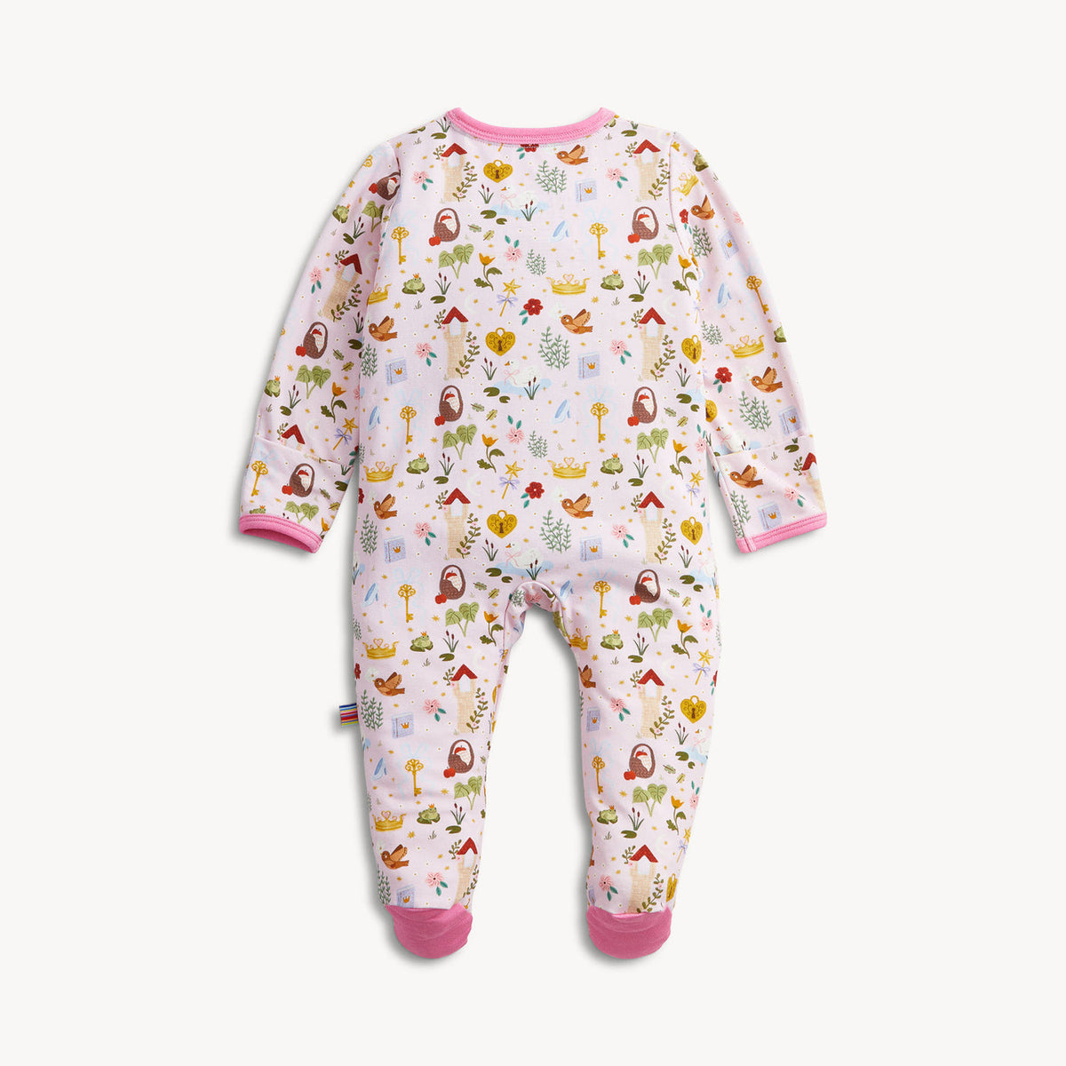 A baby footed sleeper in a light pink color with a colorful woodland pattern of trees, birds, and mushrooms, finished with solid pink trim on the collar, cuffs, and toes.