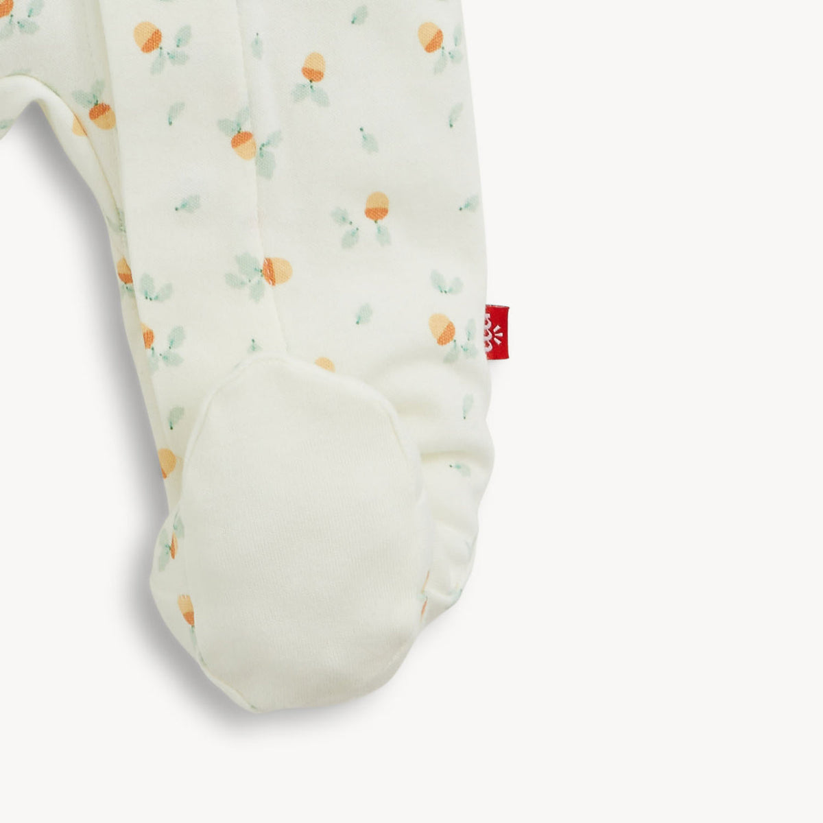 Baby boppy pillow with fruit pattern on a white background