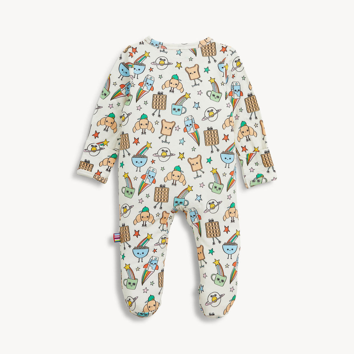 A baby footed sleeper in an off-white color with a colorful cartoon pattern of animals, rainbows, stars, and clouds, shown flat on a light gray background.
