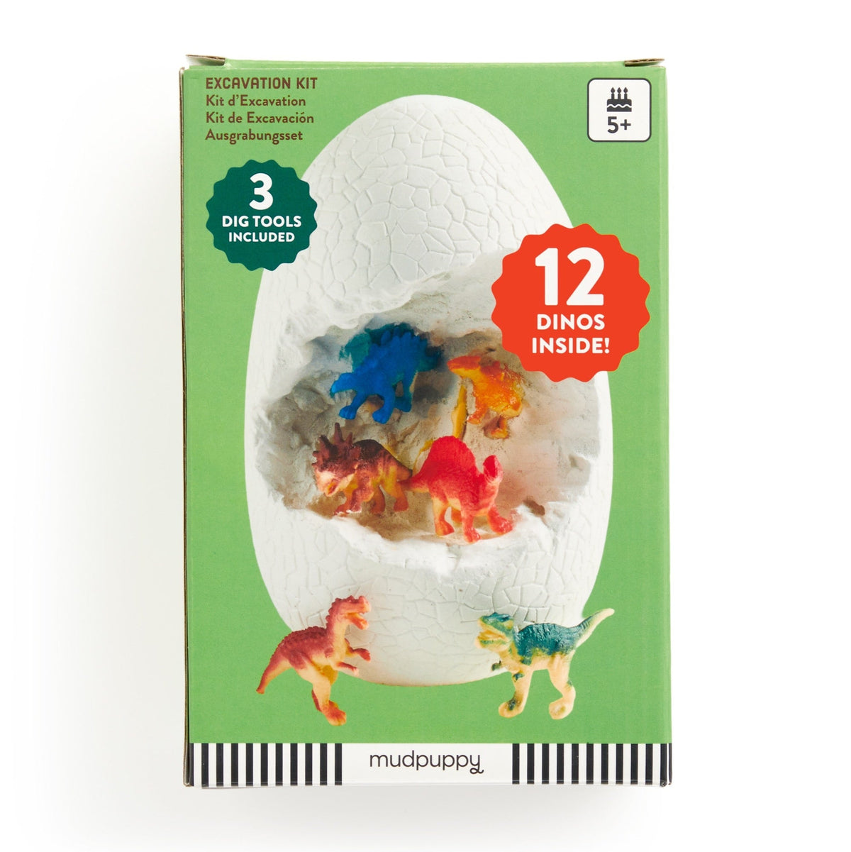 The green box for the Giant Dino Dig! Excavation Kit by Mudpuppy, featuring an illustration of a cracked white egg with colorful toy dinosaurs visible inside, alongside text indicating it includes 3 digging tools and 12 dinos inside for ages 5 and up.