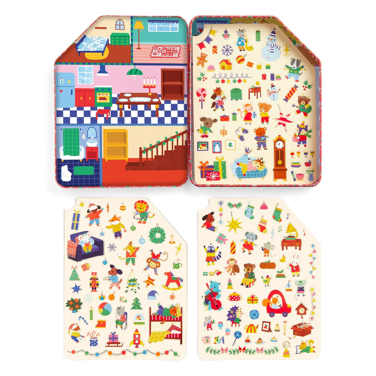 An open interior view of the Merry & Bright Magnetic Playhouse by Mudpuppy tin set showing a colorful holiday room backdrop, accompanied by two sheets displaying dozens of pre-cut holiday-themed magnetic play pieces.