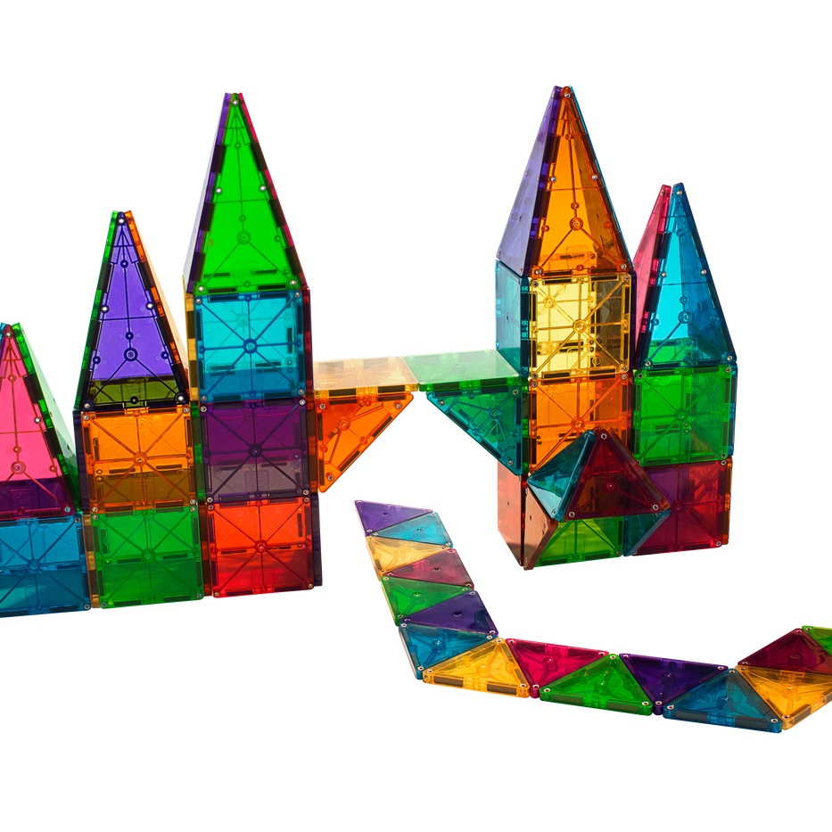 Colorful, translucent magnetic tiles assembled into castle-like structures and a winding path, shown against a transparent background.