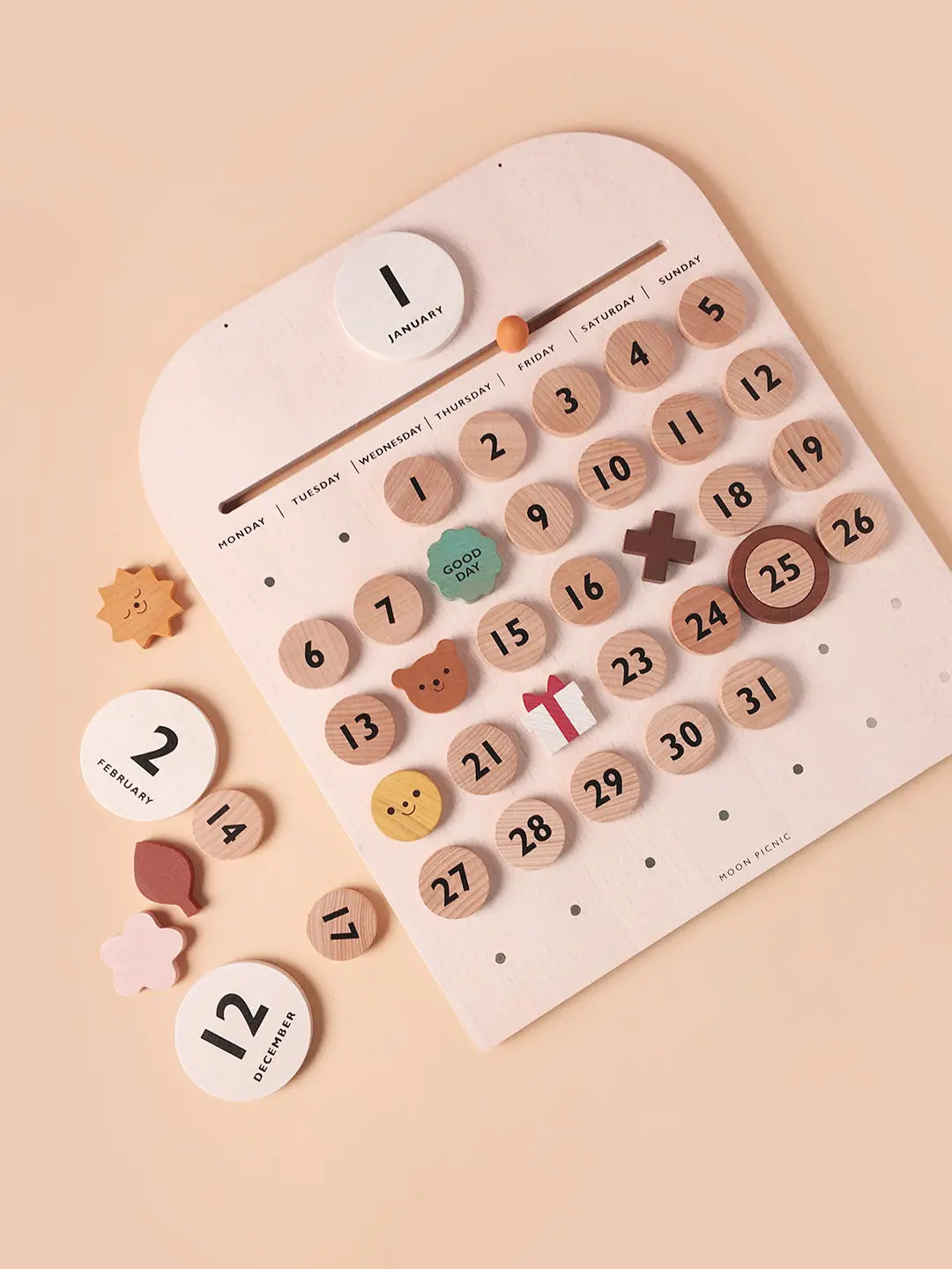 Wooden advent calendar with numbered beads on a beige background