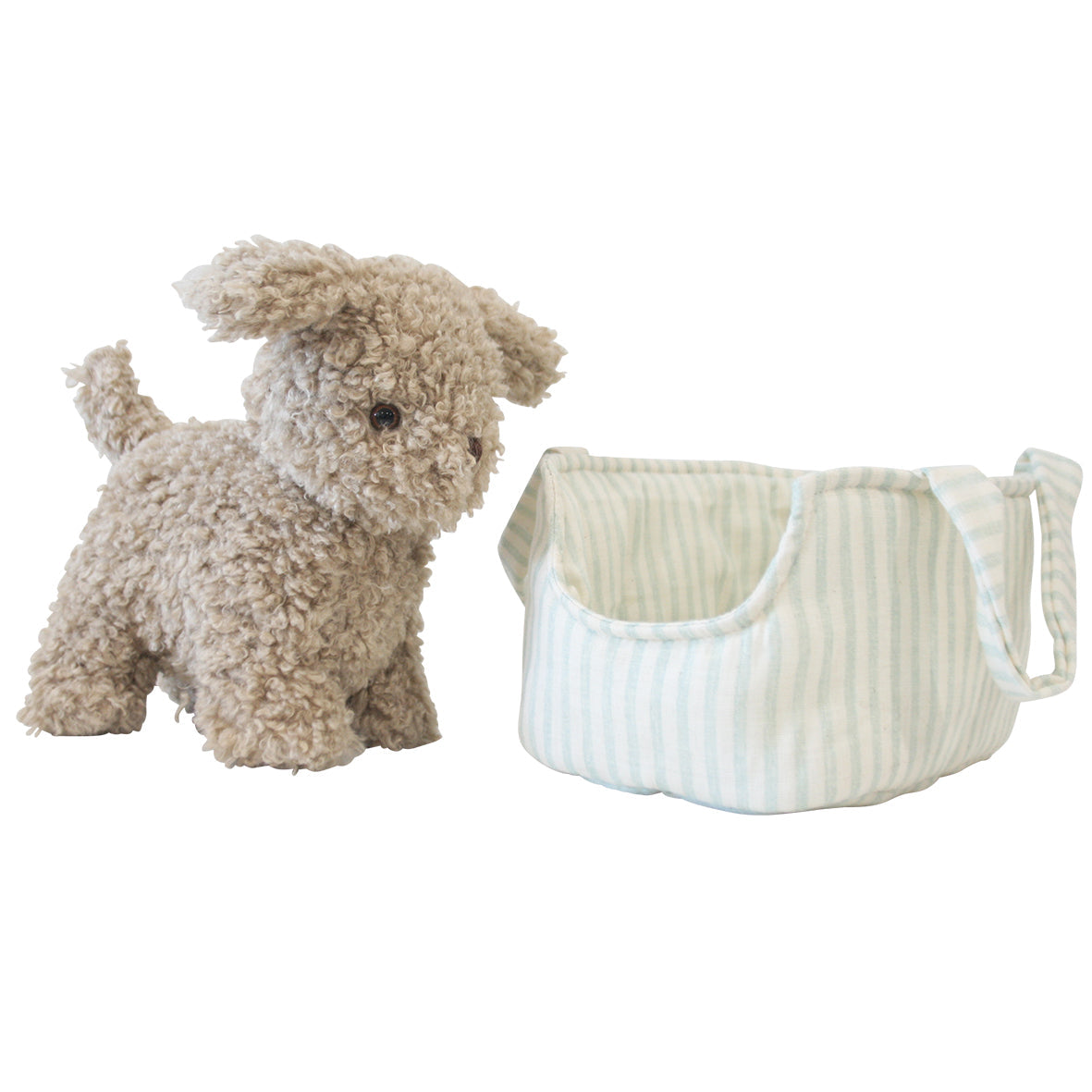 Plush dog toy next to a white laundry basket on a white background
